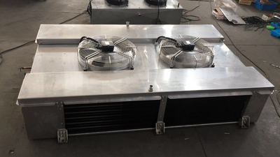Dual discharge stainless steel evaporator for processing room